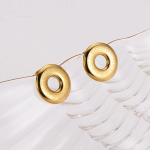 Golden round earrings with Greek fret pattern on ripple glass surface set
