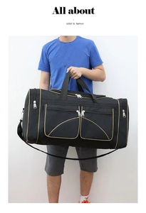 Close-up of black travel duffel bag with gold trim details and zipper pockets on side