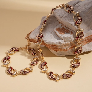 Vintage gold necklace and bracelet set with red enamel flowers and white zircon stones