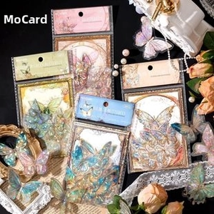 Detail of artistic gilded butterfly PET stickers set with vintage lace and roses decor