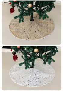 Detail showing beige and white Christmas tree skirts with shimmering sequin stars