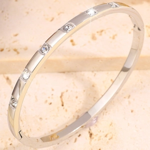 Silver plated stainless steel bracelet with white crystals and snap closure feature