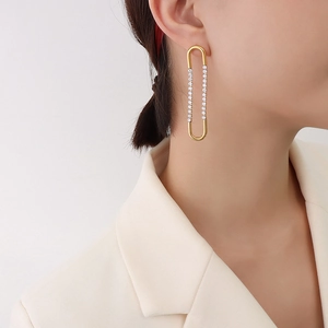 French style gold-plated U-shaped earrings with zircons on model's ear