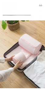 Pink mesh laundry bag set for travel storage with zipper and breathable fabric