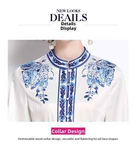 Detailed view of the elegant mandarin collar with blue floral pattern and silk-like fabric