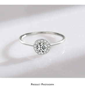 Macro shot of halo setting S925 sterling silver ring with a sparkling round zircon center