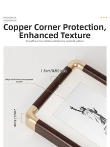 Detail of dark brown wood photo frame with golden copper corner protectors and 2cm thick edge