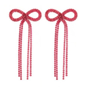 Detailed view of long red rhinestone tassel earrings with a sparkling bowknot design