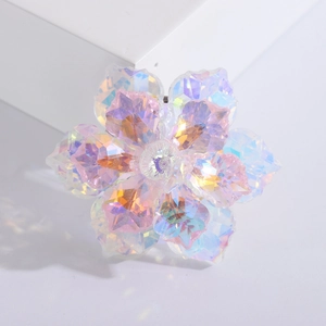 Macro view of iridescent crystal flower brooch with multi-layered colorful petals