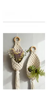 Detail view of handmade macrame hanging baskets with wooden rings and tassel fringe decor