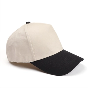 Detail view of contrast baseball cap with cream crown and black brim and top button