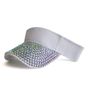 Close-up of sparkling colorful rhinestones on white summer sun visor brim