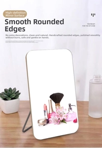 Detail showing high-definition desktop mirror with hand-polished smooth edges and metal stand