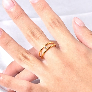 Double-layered gold titanium ring with round cubic zirconia and adjustable open design