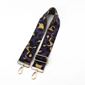 Detail of adjustable purple leopard print bag strap with light gold metal lobster clasps