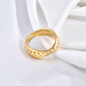 Minimalist 18K gold plated stainless steel hollow chain ring on elegant white silk background