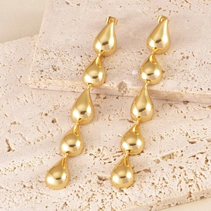 Elegant gold-tone long teardrop dangle earrings with a high-polished mirror finish