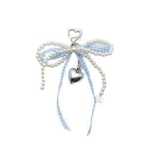 French style pearl bow bag charm with blue gingham ribbon and heart-shaped metal pendant