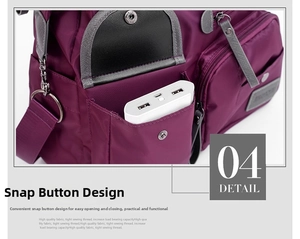 Detail of purple nylon travel bag side pocket with snap button and white power bank