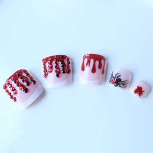 Halloween style press-on toenails with red blood drops and black spider design