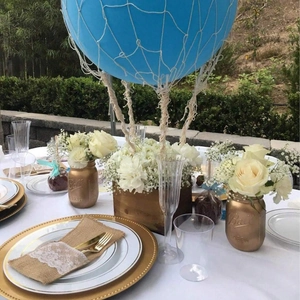 Linen lace cutlery pouch and floral balloon centerpiece for outdoor wedding table decor
