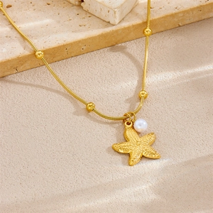 Gold starfish pendant necklace with white pearl on a delicate snake chain for women