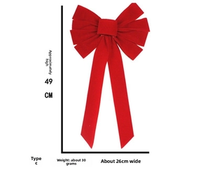 Detail view of large red velvet Christmas bow with 49cm height and 26cm width dimensions