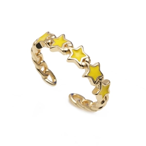 Gold plated adjustable open ring with five yellow enamel star charms on a white background