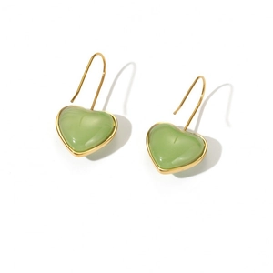 Elegant gold heart earrings with vibrant green resin pendants on a clean white background