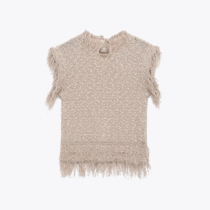 Detailed view of beige sleeveless knit top featuring stylish fringe trim and back cutout