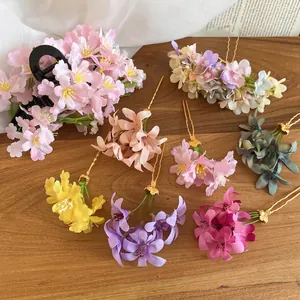 Elegant floral fabric hair pins in assorted spring colors with gold finish accents