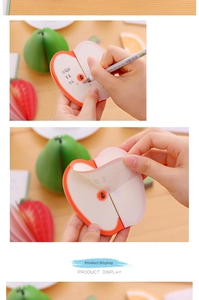 Macro shot showing 3D apple-shaped sticky notes being peeled for creative office memo use