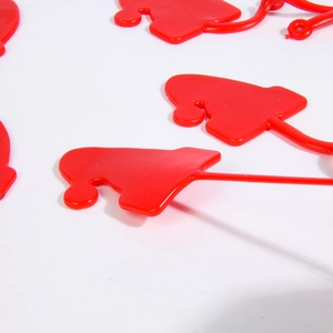 Detailed view of red TPR sticky wall climber toys featuring flexible long-arm design