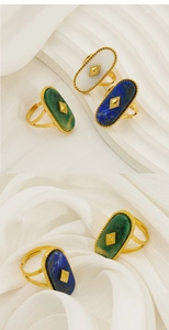 Detailed macro view of vintage oval natural stone ring with gold granulated edge detail