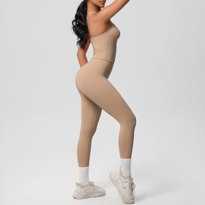 Side view of two-piece khaki workout set with high-waist leggings and cami sports bra