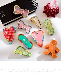 Detail showing colorful hand-woven yarn edges on various geometric acetate hair clips