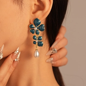 Vintage flower earrings with blue enamel and drop pearls in a retro French style
