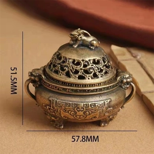 Mini vintage bronze incense burner with lion lid and traditional embossed patterns