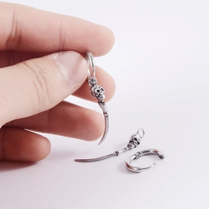 Punk style stainless steel hoop earrings with skull and curved horn pendant charms
