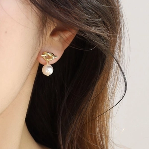 Elegant gold knot stud earrings with round white pearl pendants for a classic look