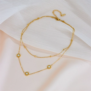 Gold double-layer stainless steel necklace with Roman numeral shell pendants