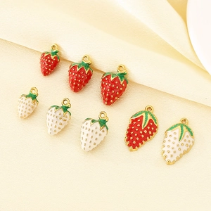 Detail view of 304 stainless steel strawberry charms with colorful enamel finish