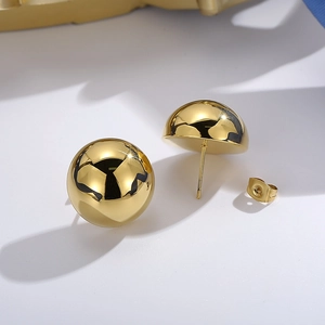 Detail of 18K gold-plated stainless steel hollow dome stud earrings with mirror finish