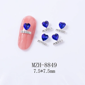 Detail of blue heart nail charms with silver accents and 7.5mm size dimensions