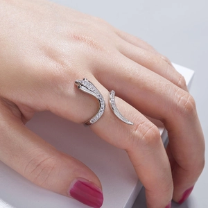 Detail of silver snake ring with pavé cubic zirconia wrap around a model's finger