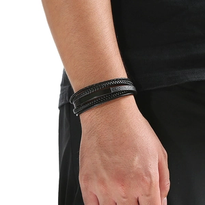 Close-up of men's multilayer braided leather bracelet with a polished stainless steel plate