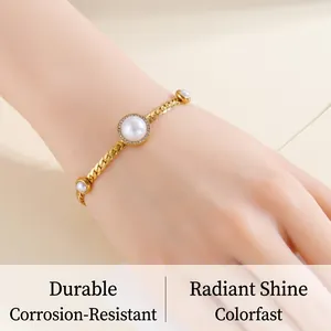 Detailed view of elegant gold-plated bracelet with center pearl and sparkling crystals