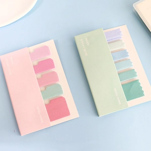 Close-up of pastel sticky notes sets in pink and mint green with wavy index tabs