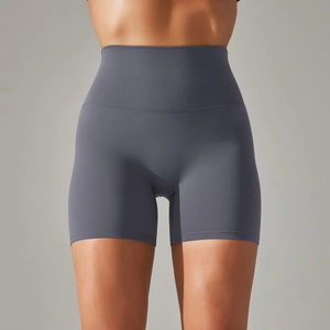 Close-up of charcoal grey high-waist yoga shorts with seamless matte finish fabric