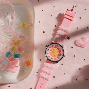 Detailed view of pink quartz watch with waffle dial and silicone strap for girls